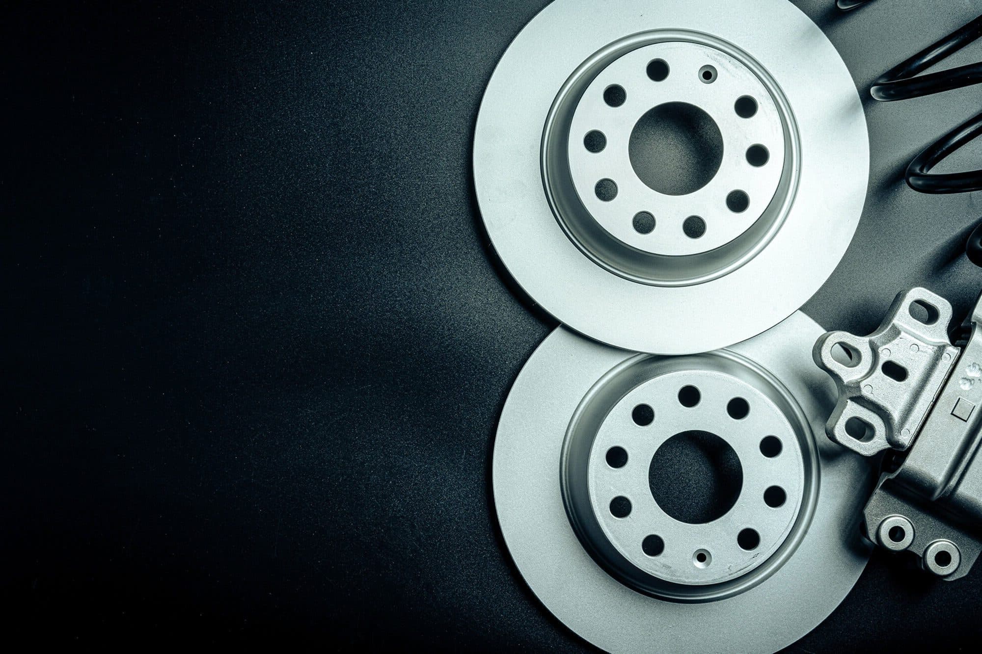 car-break-disc-on-black-background-close-up-2021-09-03-09-46-08-utc-e1654590642585.jpg